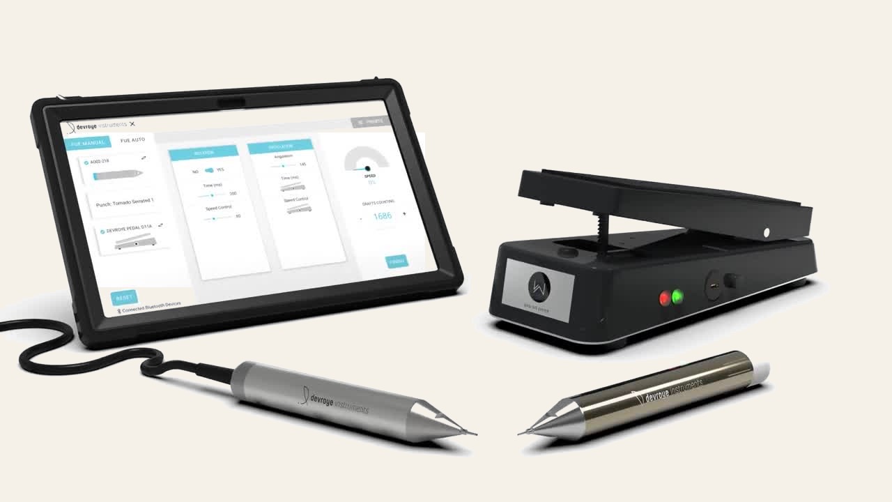 The WAW FUE System by Devroye Instruments — control tablet with live graft counting, foot pedal, and wired and wireless extraction handpieces